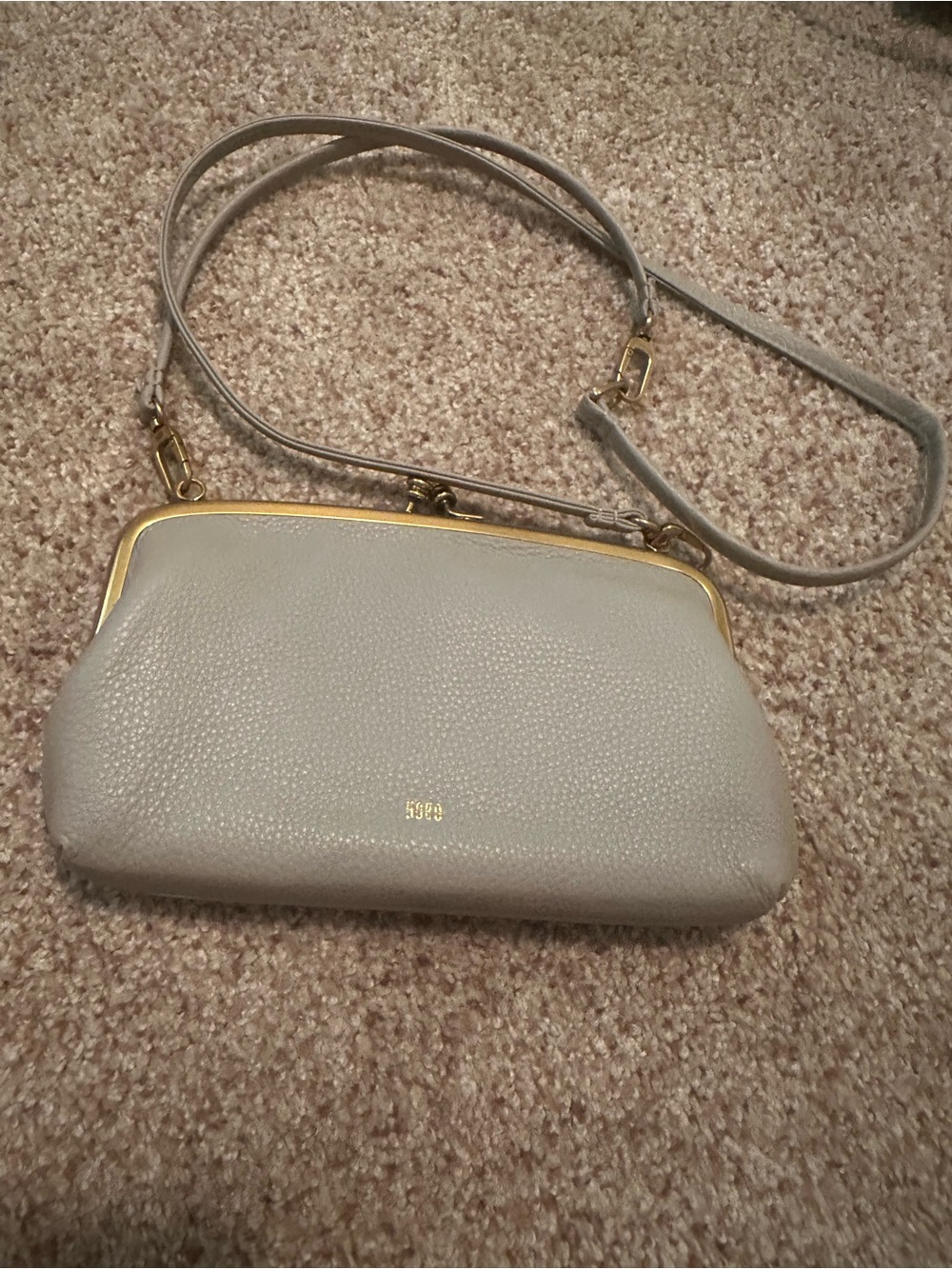 HOBO Pebbled Leather Clutch in Light Gray with Gold Trim